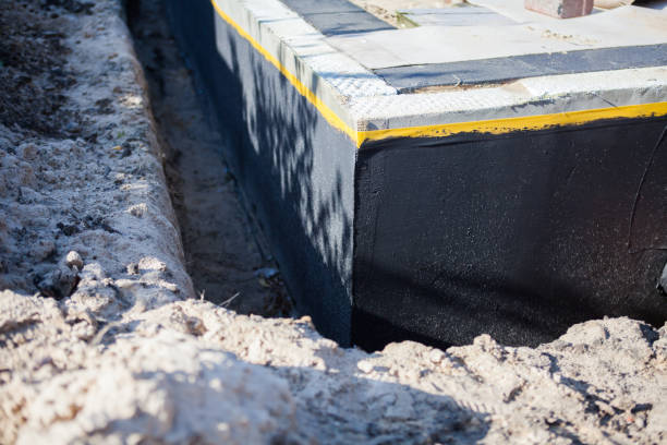 Professional Waterproofing technician working in Grand Rapids, MN